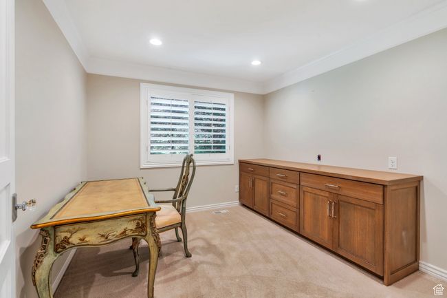 Office space with crown molding, baseboards, recessed lighting, and light carpet | Image 16
