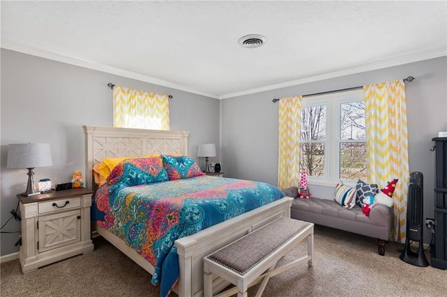 Bedroom with ornamental molding and carpet flooring | Image 27