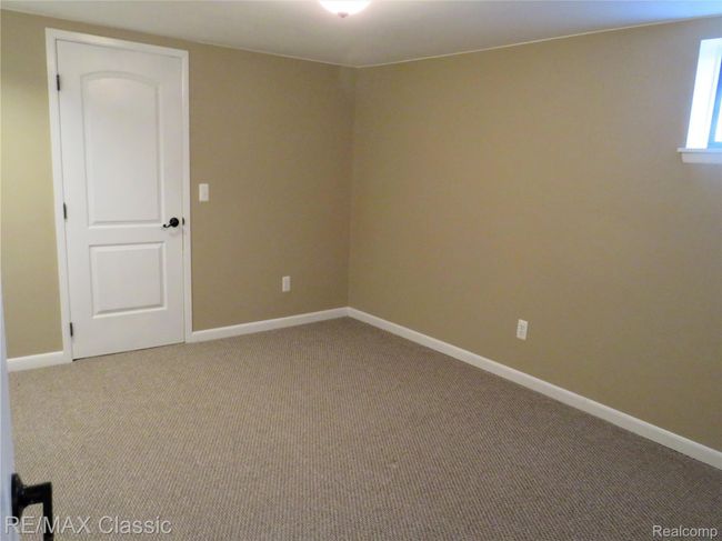 Another view of the 2nd bedroom. There's another room behind the door, to conduct work form home business. | Image 20