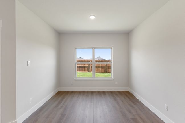 Empty room featuring wood finished floors and baseboards | Image 10