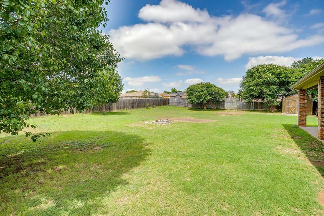 View of yard with a fire pit | Image 36