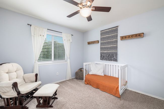 Carpeted bedroom with a closet and ceiling fan | Image 31