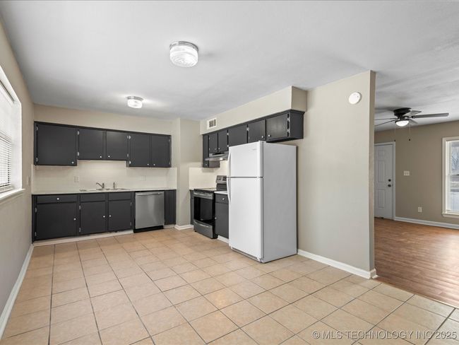 View from back door into the Kitchen New stove and dishwasher. Refrigerator stays too | Image 6