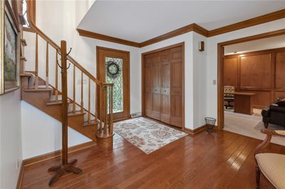 As You Enter The Home You Are Greeted By The Spacious Foyer With Gleaming Hardwood Floors. | Image 2