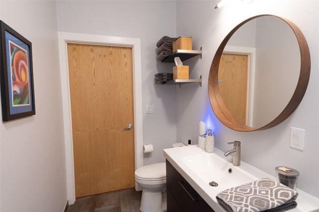 Bathroom featuring vanity and toilet | Image 9