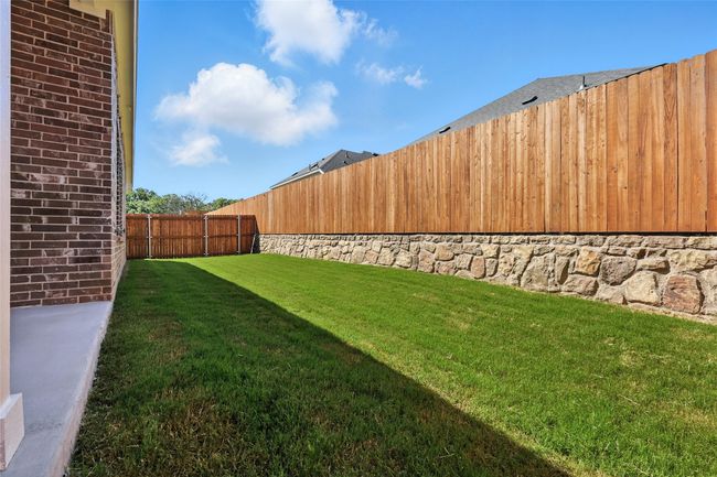 View of fenced backyard | Image 31