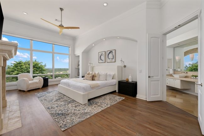 Bedroom featuring a sink, multiple windows, ornamental molding, dark wood-style floors, and recessed lighting | Image 13