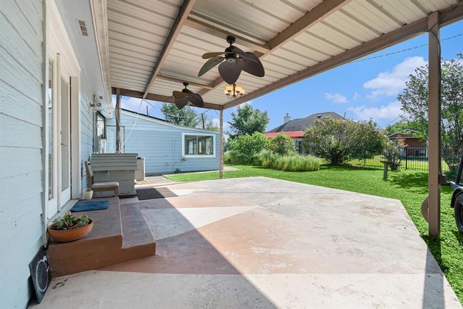 Covered back porch with fans. Perfect for relaxing. | Image 24