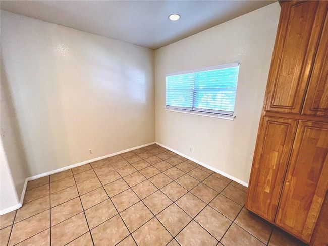 Unfurnished room with light tile patterned flooring and baseboards | Image 6
