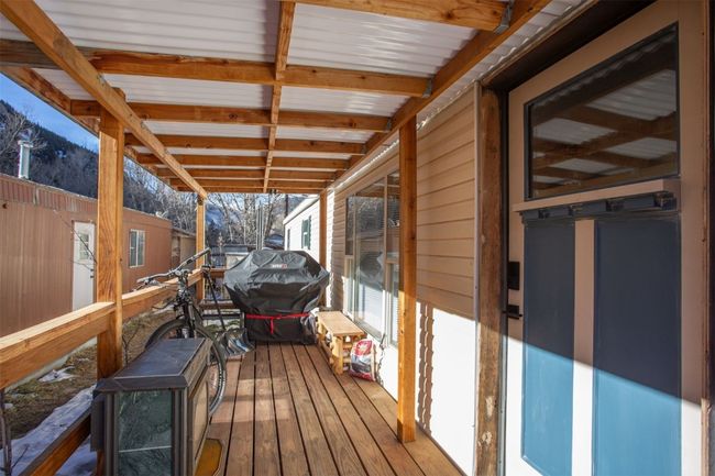 Wooden deck with area for grilling | Image 16