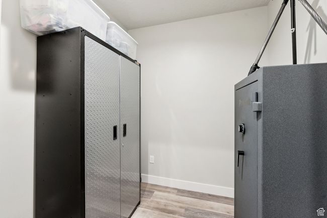 Interior space with wood finished floors and baseboards | Image 56