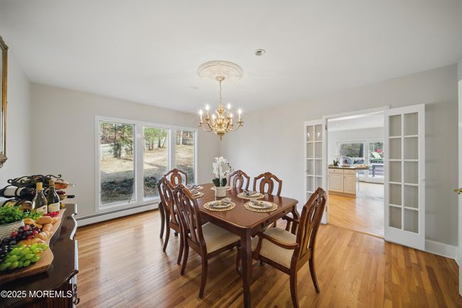 Dining Room w hardwood floors, large windows and adjacent to eat in kitchen | Image 19