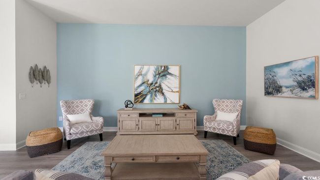 Living area featuring baseboards and dark wood-type flooring | Image 12