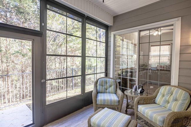 Sunroom / solarium with a wealth of natural light and wood ceiling | Image 32