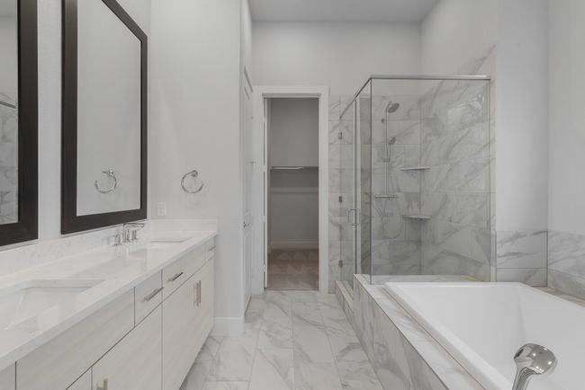 Full bathroom with marble finish floor, a sink, and a stall shower | Image 24