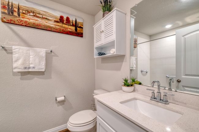 Bathroom with vanity, toilet, and a shower/tub | Image 25