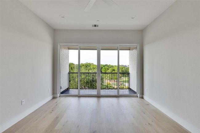 Spare room featuring light wood-type flooring, a ceiling fan, and baseboards | Image 34