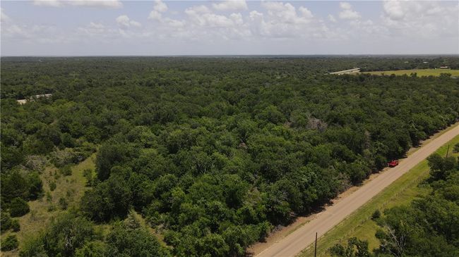 Aerial view of a heavily wooded area | Image 12