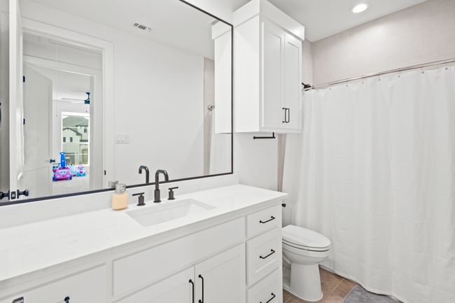 Full bath with vanity, recessed lighting, tile patterned flooring, and curtained shower | Image 24