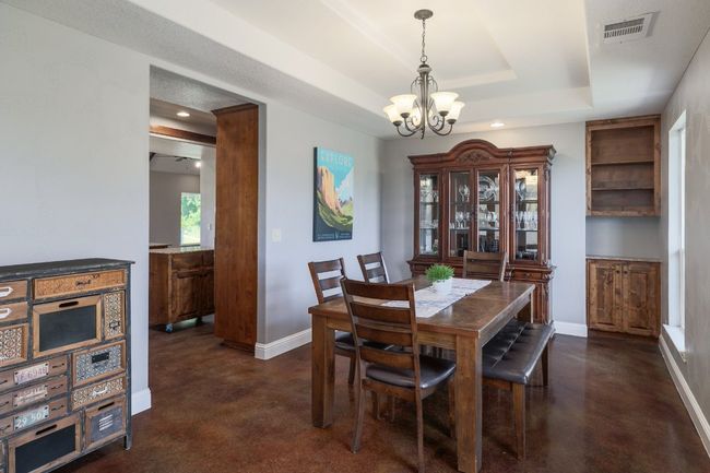Dining room on front of house with entry to kitchen. | Image 14