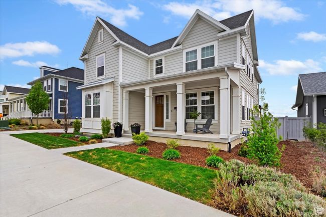 View of front of house with fence, a porch, and roof with shingles | Image 38