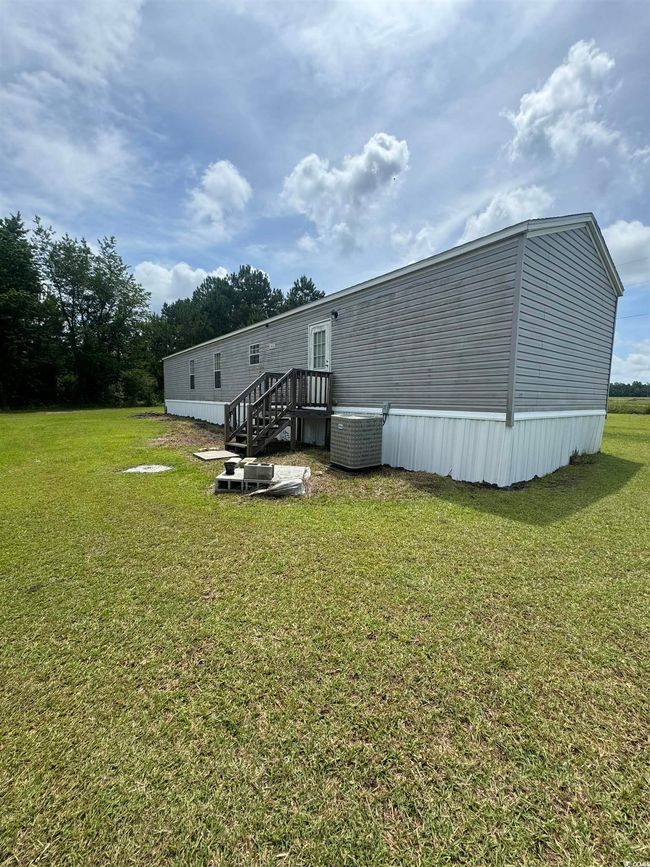 Rear view of property featuring a lawn | Image 17
