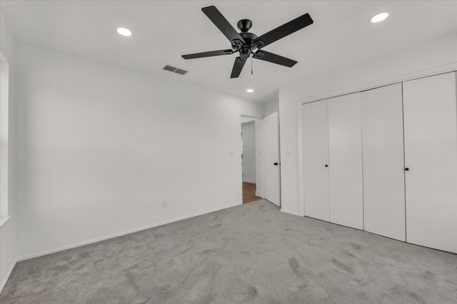 Unfurnished bedroom featuring visible vents, baseboards, a closet, recessed lighting, and carpet flooring | Image 30