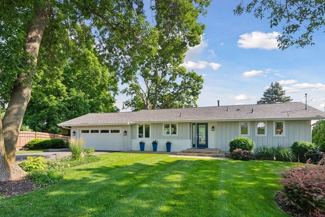 This charming walkout rambler provides a year-round vacation feel! | Image 35