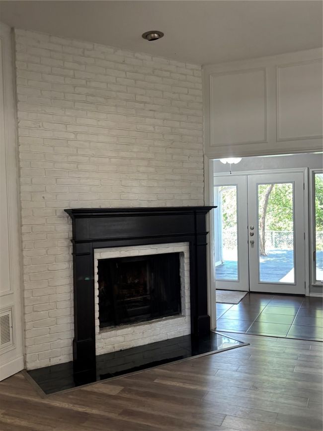 The gas fireplace in the center of the house makes for cozy winters. | Image 6