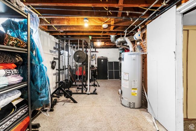 Unfinished below grade area with gas water heater | Image 44