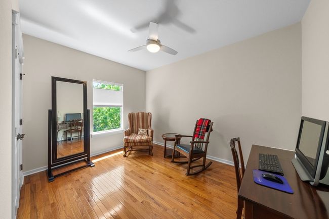 Living area with baseboards, a ceiling fan, and light wood finished floors | Image 21