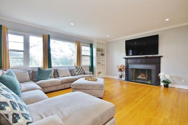 Living Room has fireplace with mantle | Image 10
