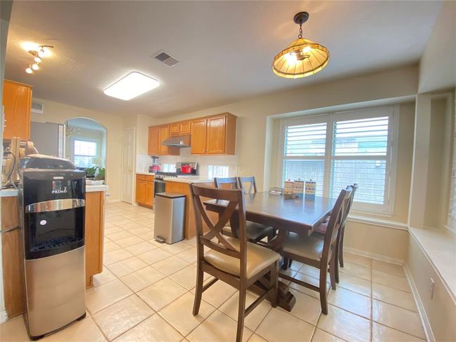 Breakfast area connect to kitchen. Also step away from backyard balcony. | Image 9