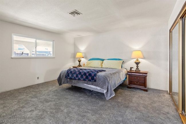 Bedroom featuring visible vents, carpet floors, and a textured ceiling | Image 19