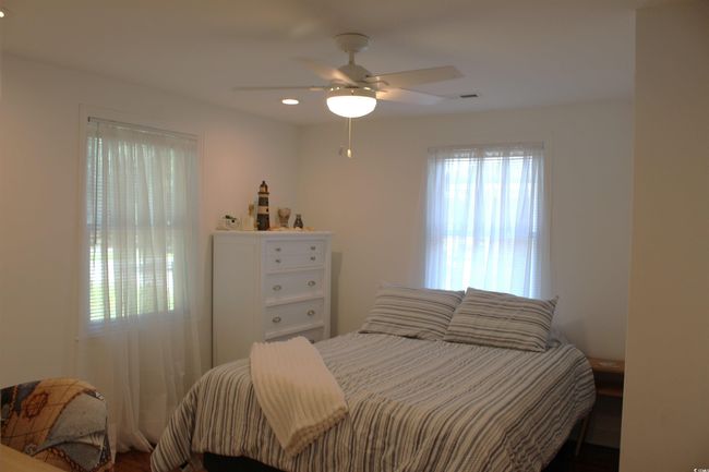Bedroom with ceiling fan and recessed lighting | Image 13