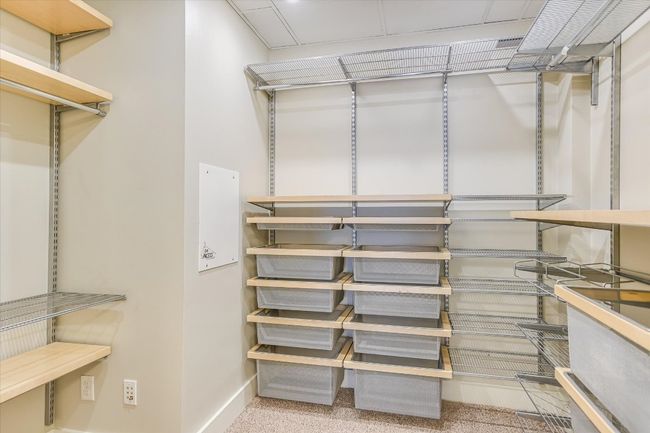 Spacious closet with carpet floors | Image 11