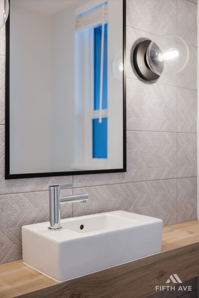 Bathroom with wood finished floors and tile walls | Image 36
