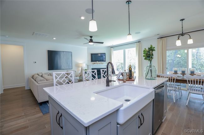 Kitchen with granite countertops, gas cooking, island, pantry, stainless steel appliances and LED recessed lighting. | Image 6