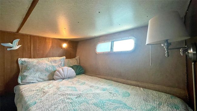 Bedroom featuring carpet floors and a textured ceiling | Image 14