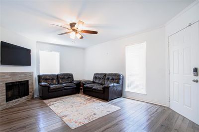 Living room with hardwood / wood-style flooring, ornamental molding, and ceiling fan | Image 3