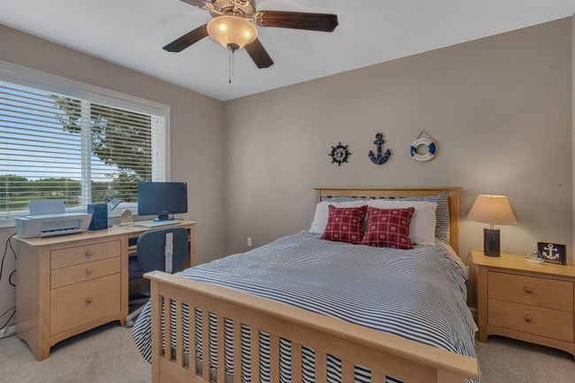 3rd bedroom on the upper level with lake views. Also has walk-in closet | Image 25