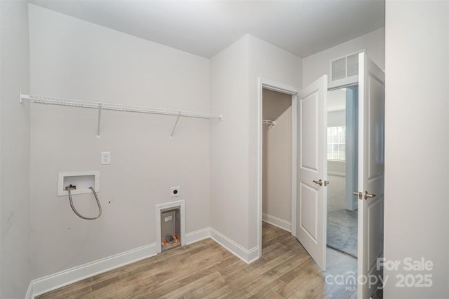 Laundry and Mud Room with a storage closet This area leads to the garage and into the home | Image 21