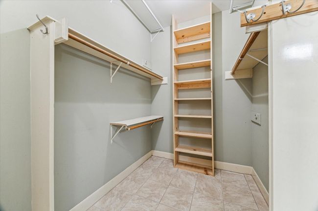 There is plenty of hanging space, along with additional shoe and bag shelving. | Image 23
