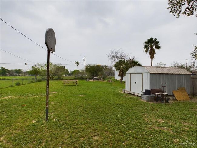 View of yard with a shed | Image 4