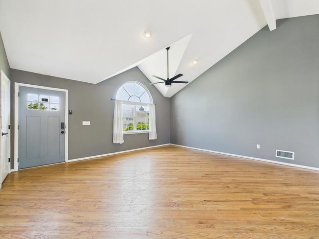 Entrance foyer featuring ceiling fan, healthy amount of natural light, and light wood finished floors | Image 14