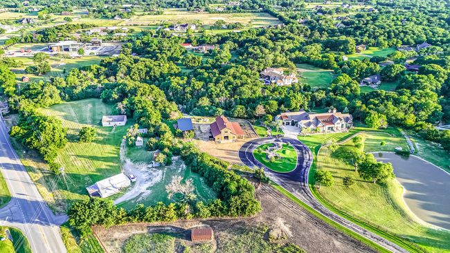 Aerial view of property and surrounding area featuring a large body of water | Image 10