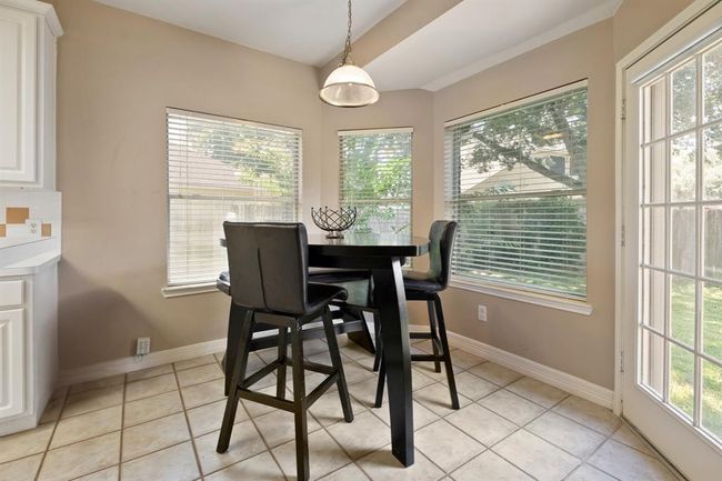 The perfect breakfast nook, overlooking the wall of windows to the backyard. | Image 9