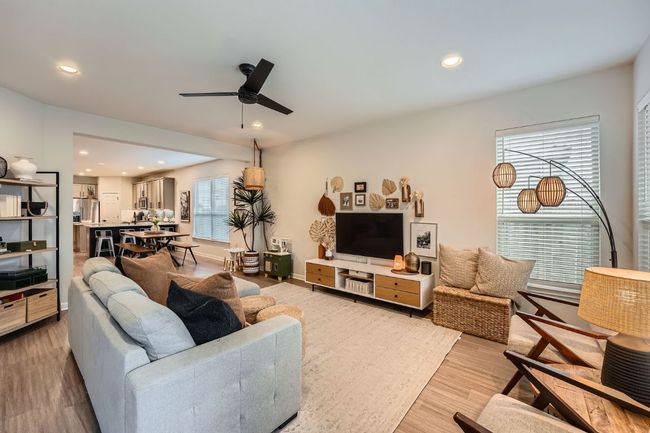 Living area featuring recessed lighting, light wood finished floors, baseboards, and ceiling fan | Image 5