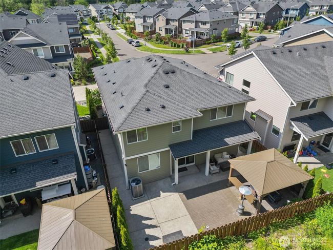 Low maintenance backyard with patio pavers installed to create expansive entertainment space! | Image 34
