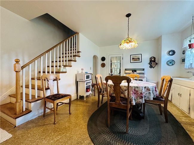 Unit 1 - Kitchen - Stairs leading to the 2nd floor. | Image 11